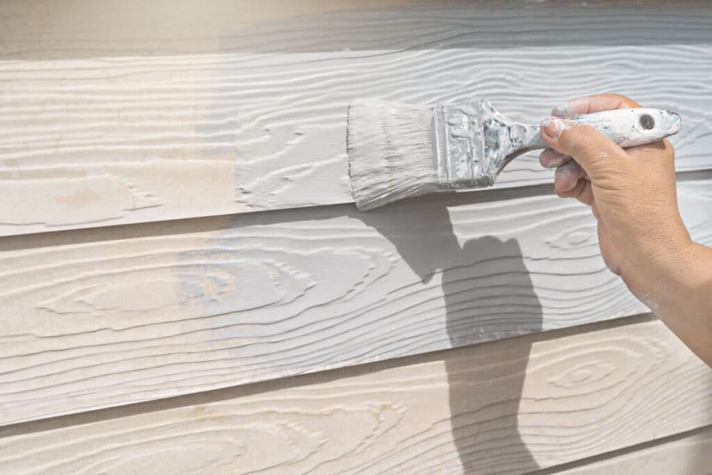 professional painter painting a home's exterior in Florida